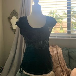 A black vintage t-shirt with jewels.